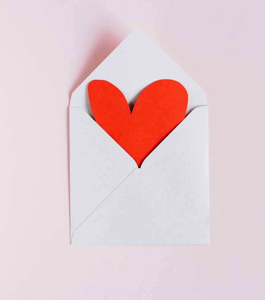white envelope with red paper heart